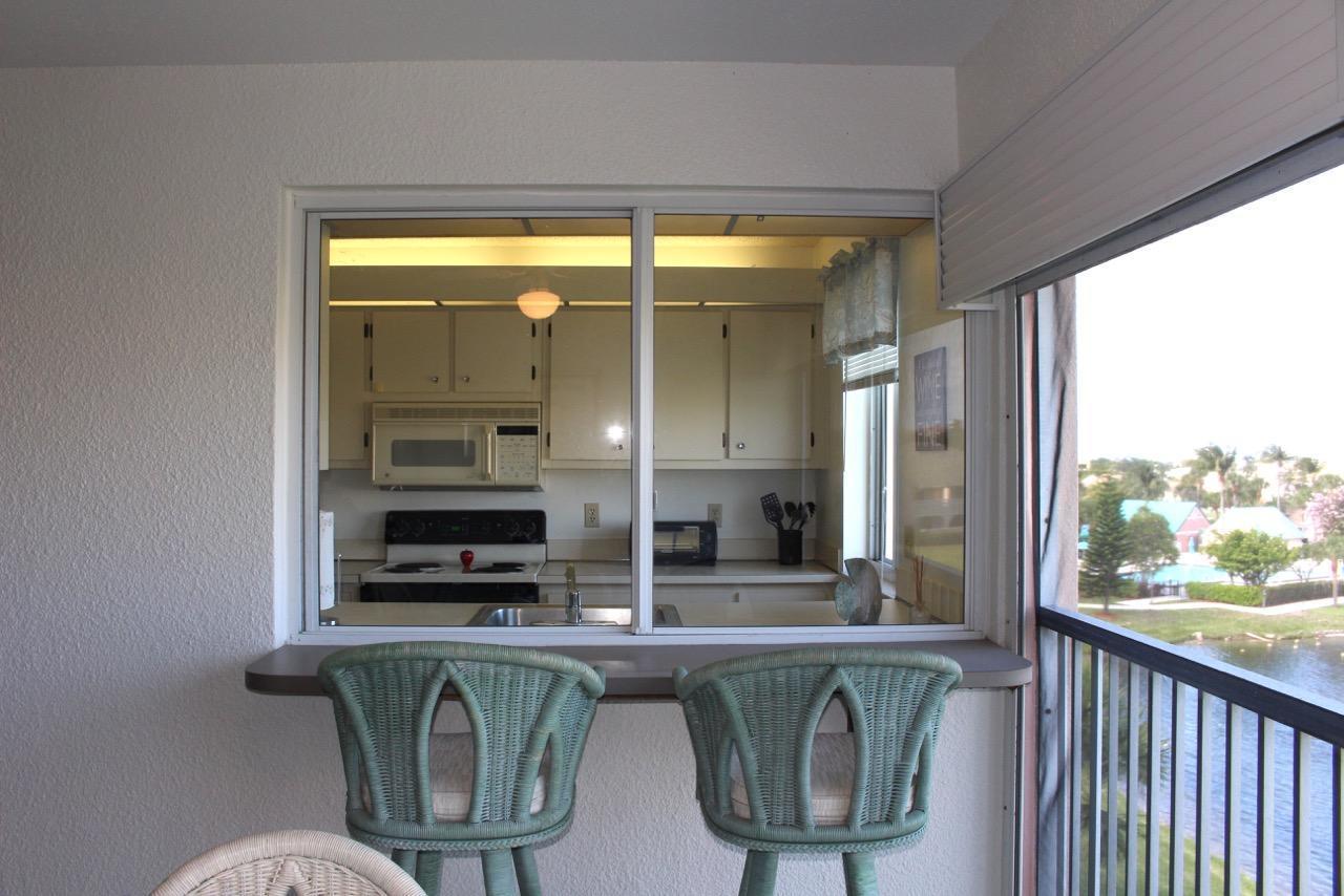 353 Highway 1, Unit F408 Jupiter, FL 33477 - Photo 7 of 27 Jupiter Bay 408 balcony to kitchen