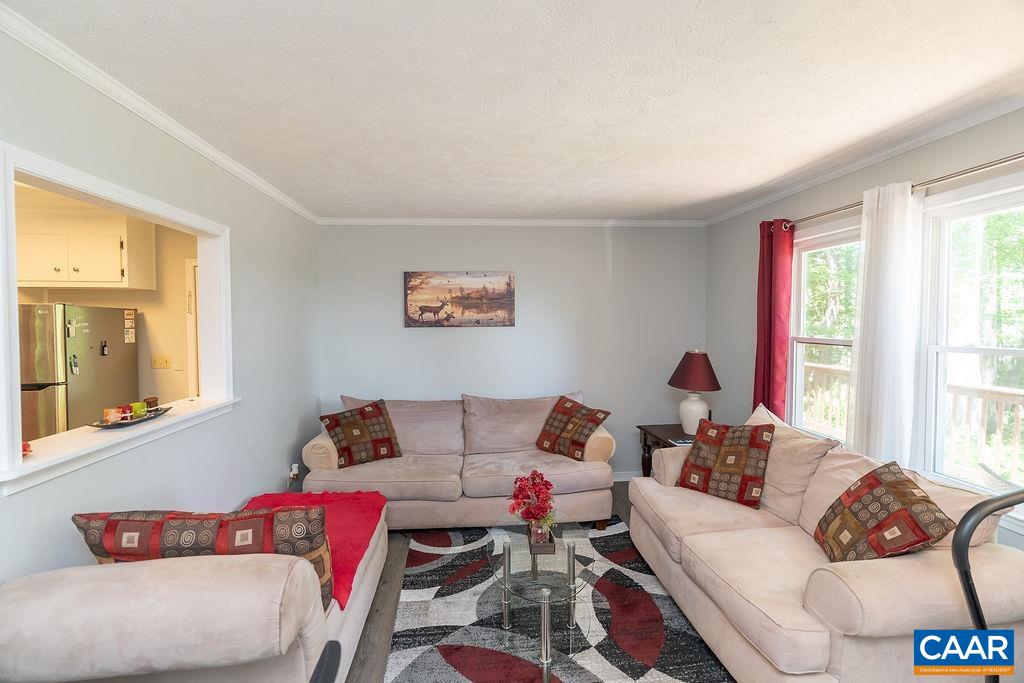 6920 Albevanna Spring Road Scottsville, VA 24590 - Photo 5 of 47 a living room with furniture and a large window