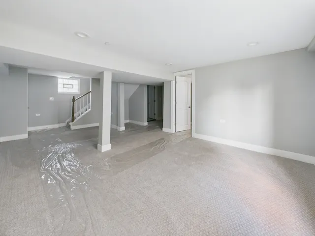 a view of a big room with closet and windows