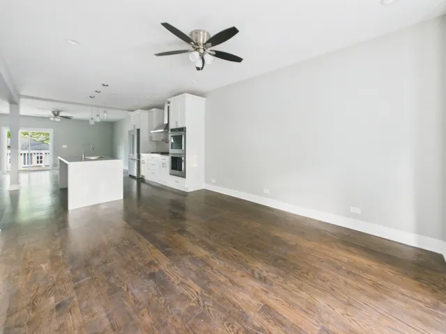a view of a kitchen with a sink and a window