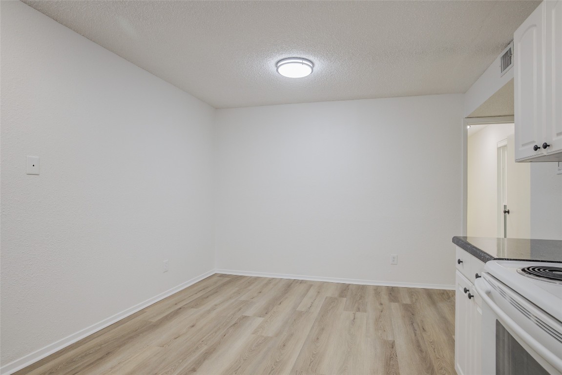 8600 Fathom Circle, Unit 1303 Austin, TX 78750 - Photo 17 of 30 a view of a kitchen with a sink and a stove top oven