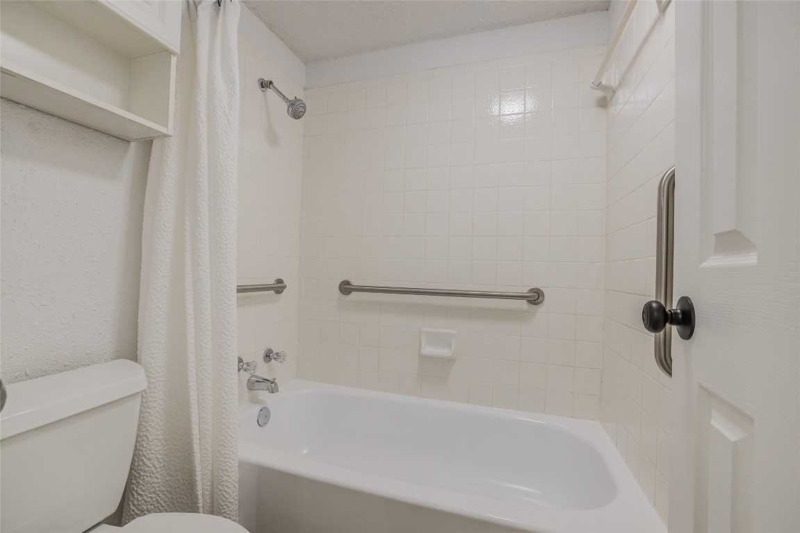 8600 Fathom Circle, Unit 1303 Austin, TX 78750 - Photo 20 of 30 a bathroom with a bathtub and a shower