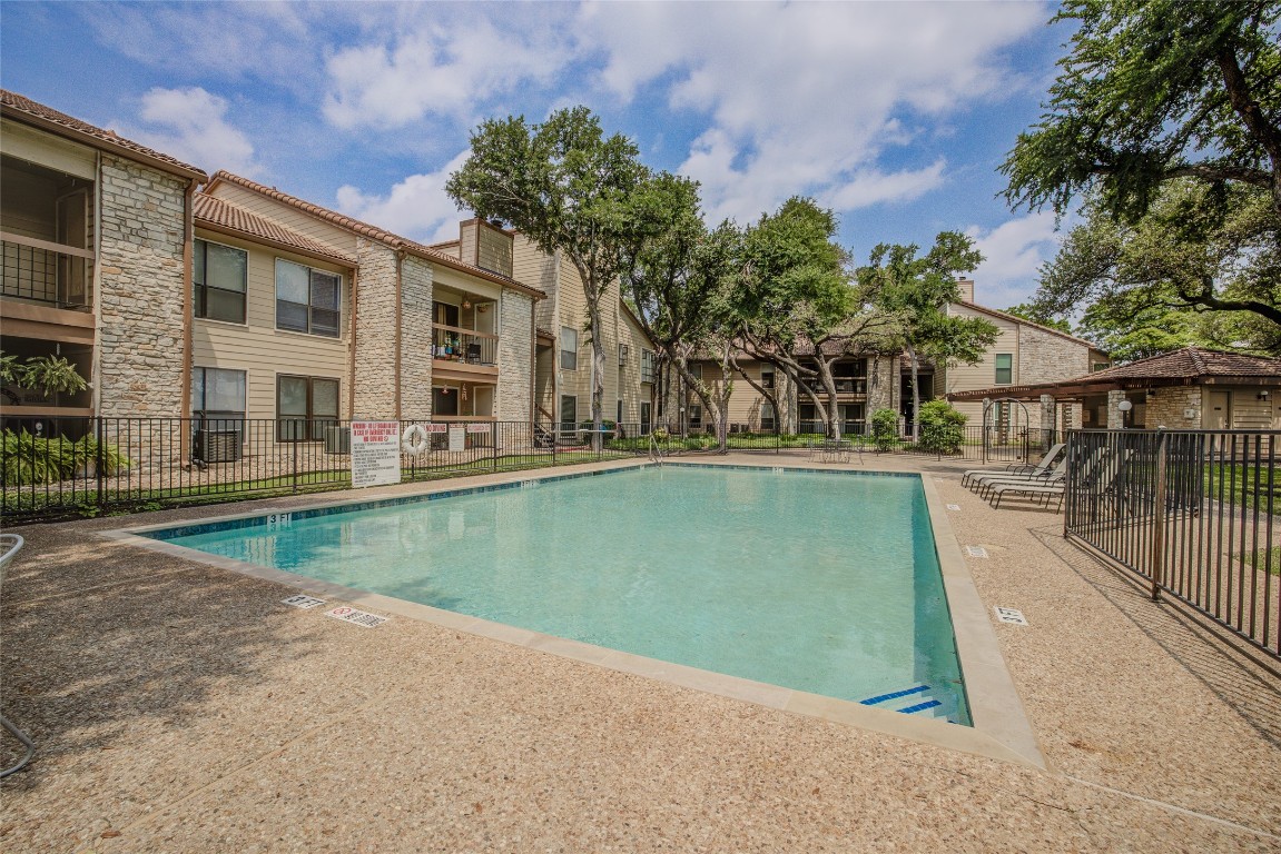 8600 Fathom Circle, Unit 1303 Austin, TX 78750 - Photo 24 of 30 a view of swimming pool with a yard