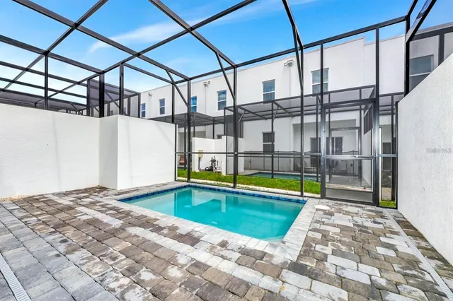 a view of swimming pool with a yard