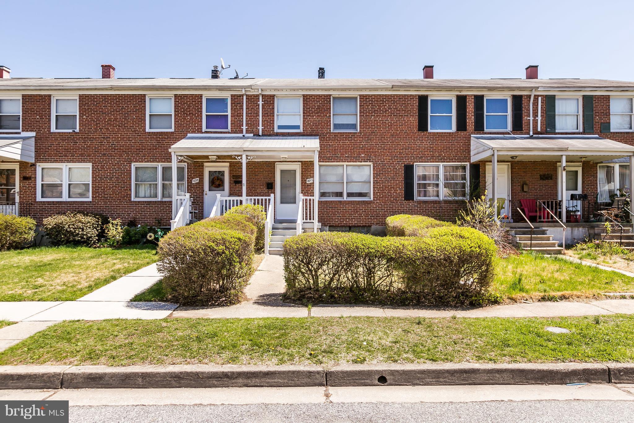 1693 Poles Road Baltimore, MD 21221 - Photo 2 of 19 a front view of a house with a yard