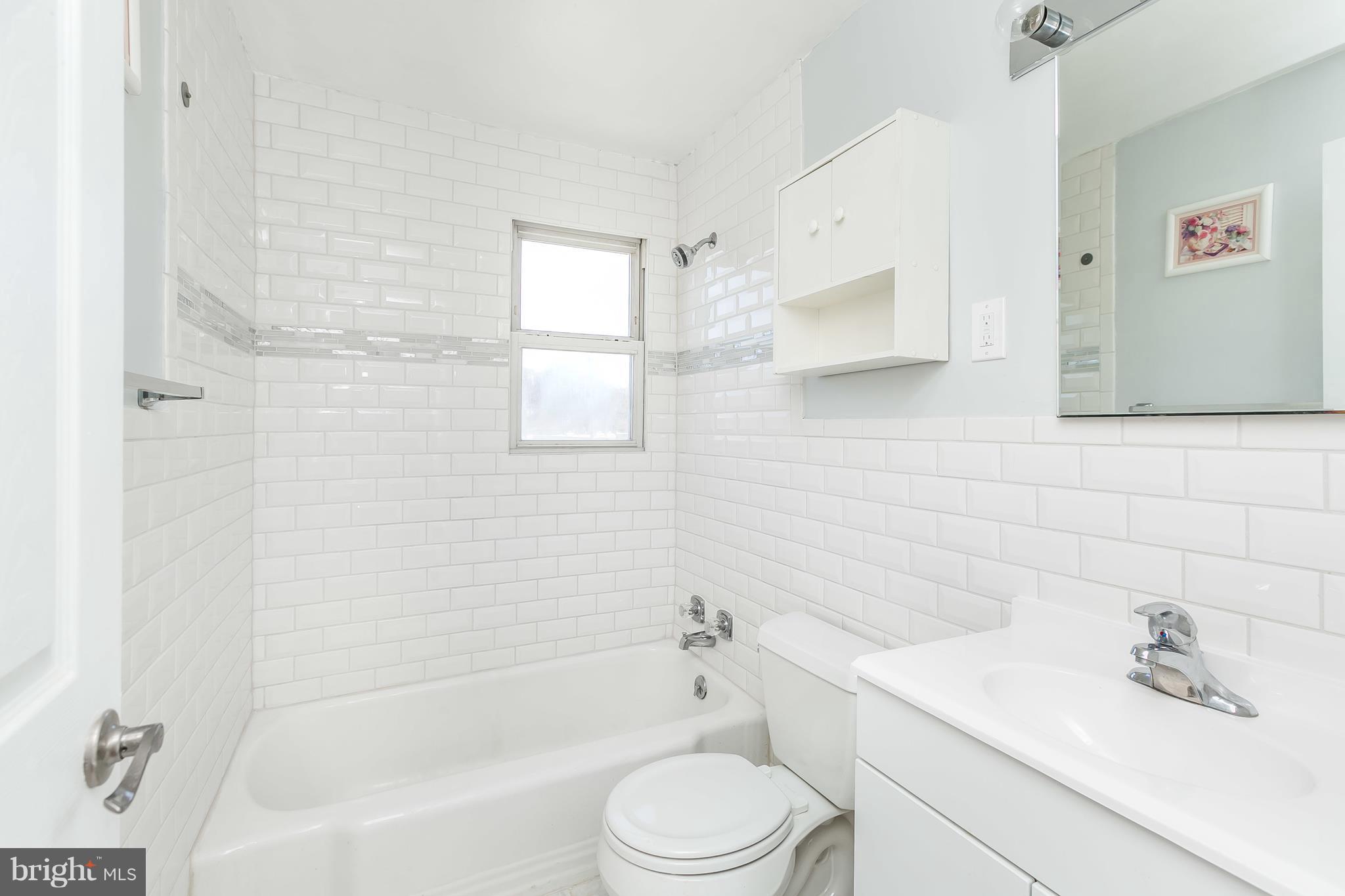 1693 Poles Road Baltimore, MD 21221 - Photo 14 of 19 a bathroom with a sink toilet and shower