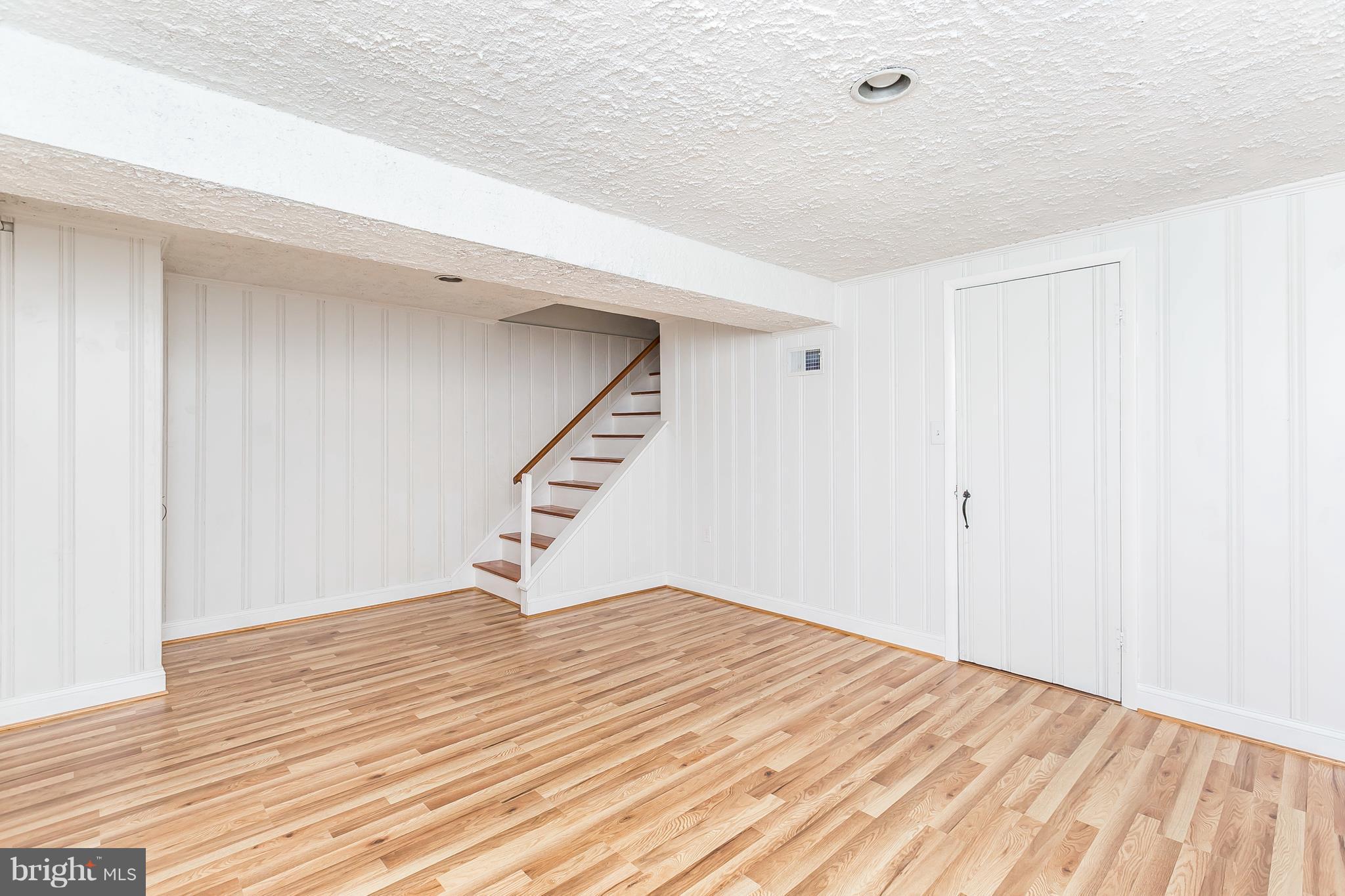 1693 Poles Road Baltimore, MD 21221 - Photo 15 of 19 a view of an empty room with wooden floor