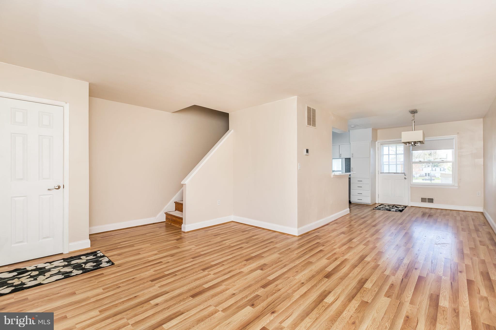1693 Poles Road Baltimore, MD 21221 - Photo 5 of 19 a view of a room with wooden floor and white walls