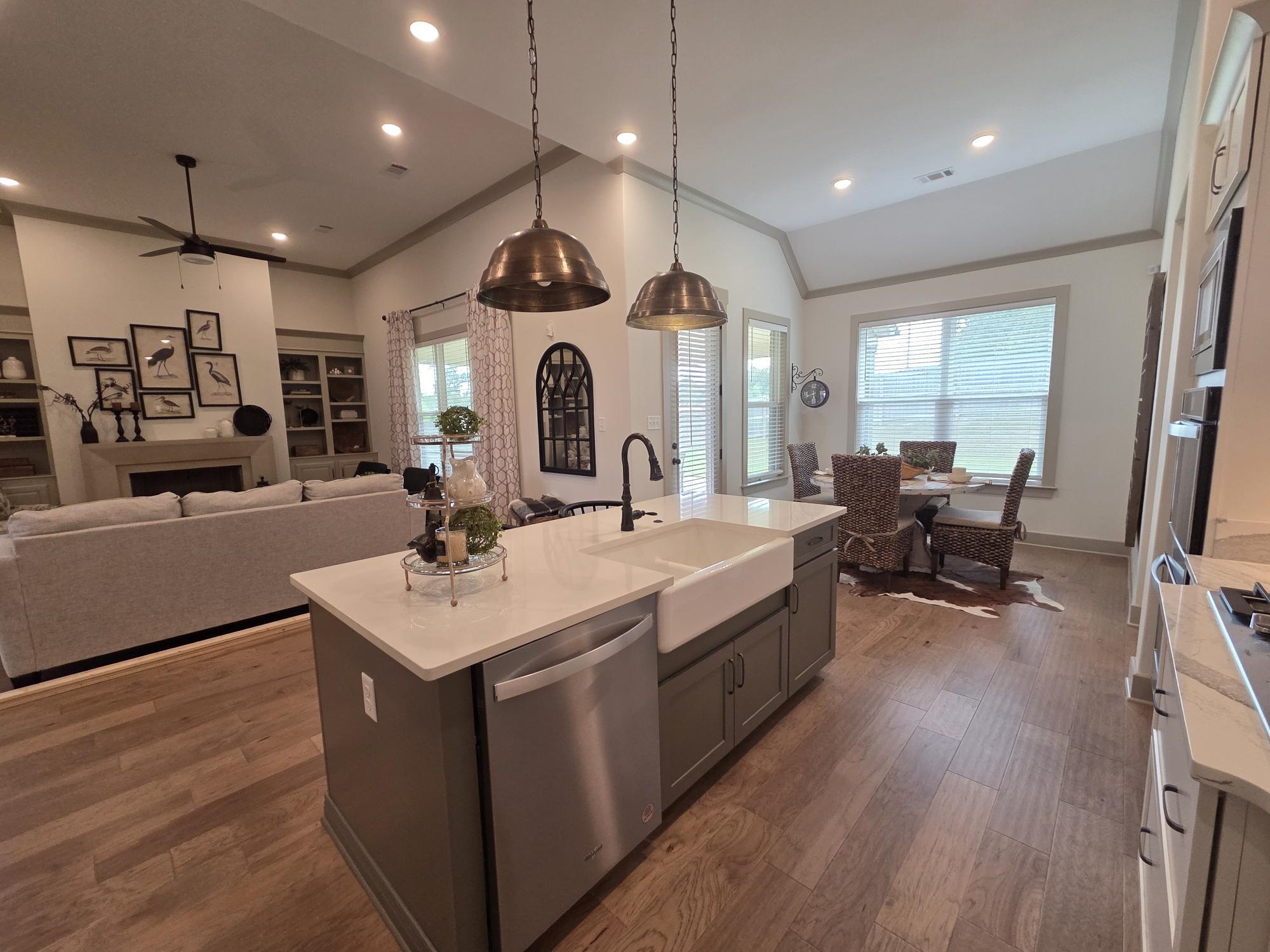 657 Mount Laurel Drive Collierville, TN 38017 - Photo 11 of 40 a large white kitchen with a large window and stainless steel appliances