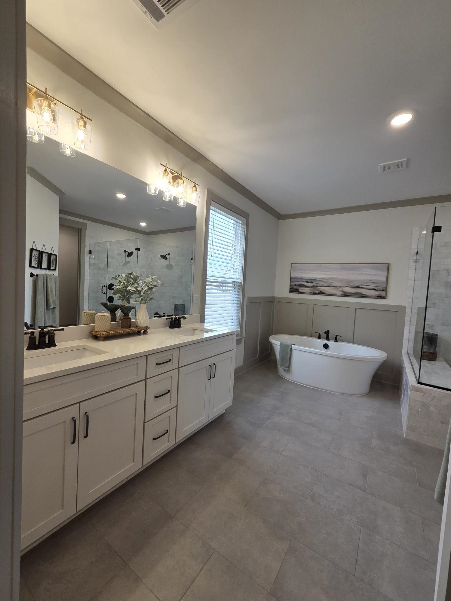 657 Mount Laurel Drive Collierville, TN 38017 - Photo 19 of 40 a spacious bathroom with a double vanity sink and a mirror