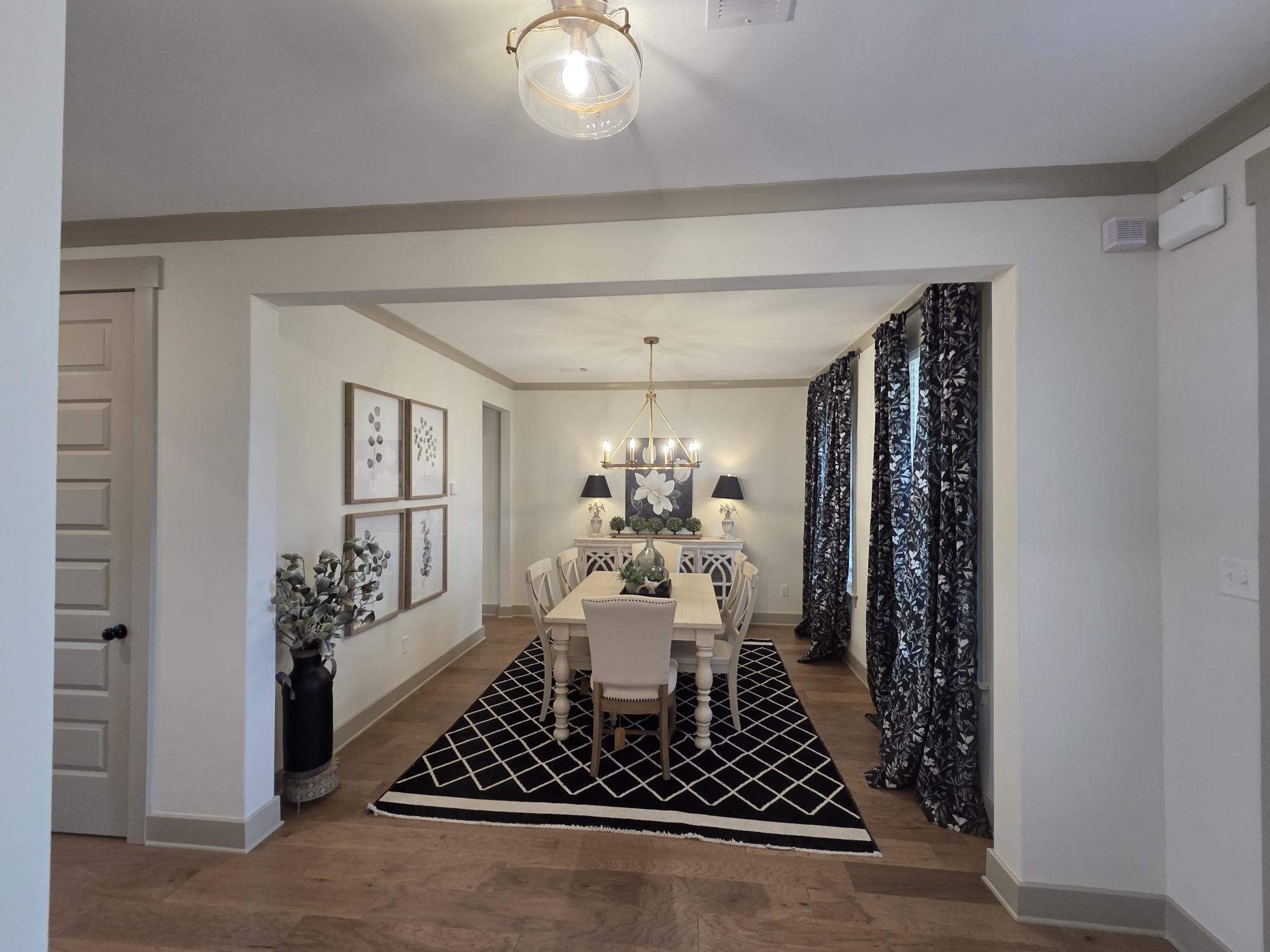 657 Mount Laurel Drive Collierville, TN 38017 - Photo 2 of 40 a living room with furniture and a chandelier