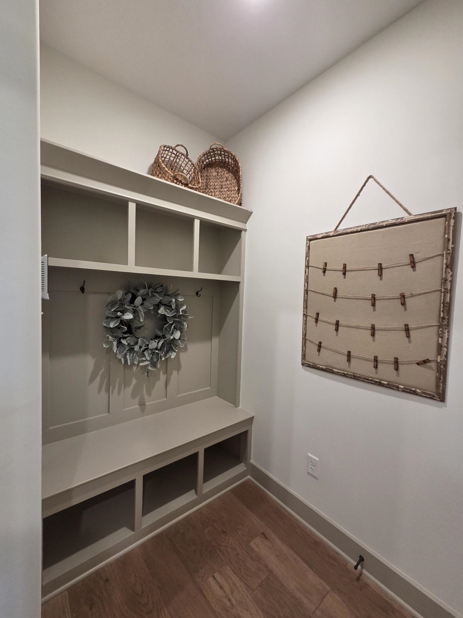 657 Mount Laurel Drive Collierville, TN 38017 - Photo 27 of 40 a view of staircase with wooden floor and cabinet