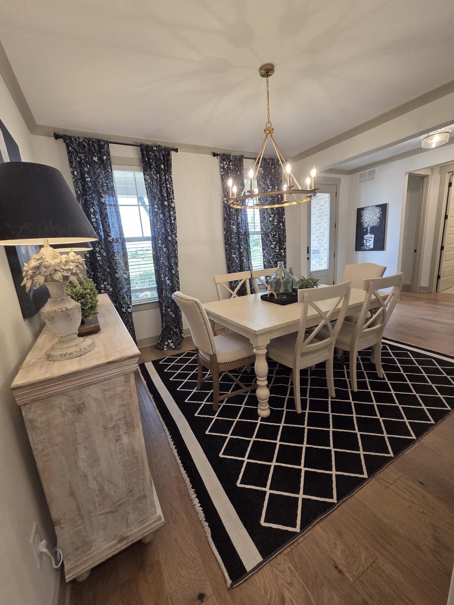 657 Mount Laurel Drive Collierville, TN 38017 - Photo 28 of 40 a very nice looking dining room with a table or chairs and a wooden floor
