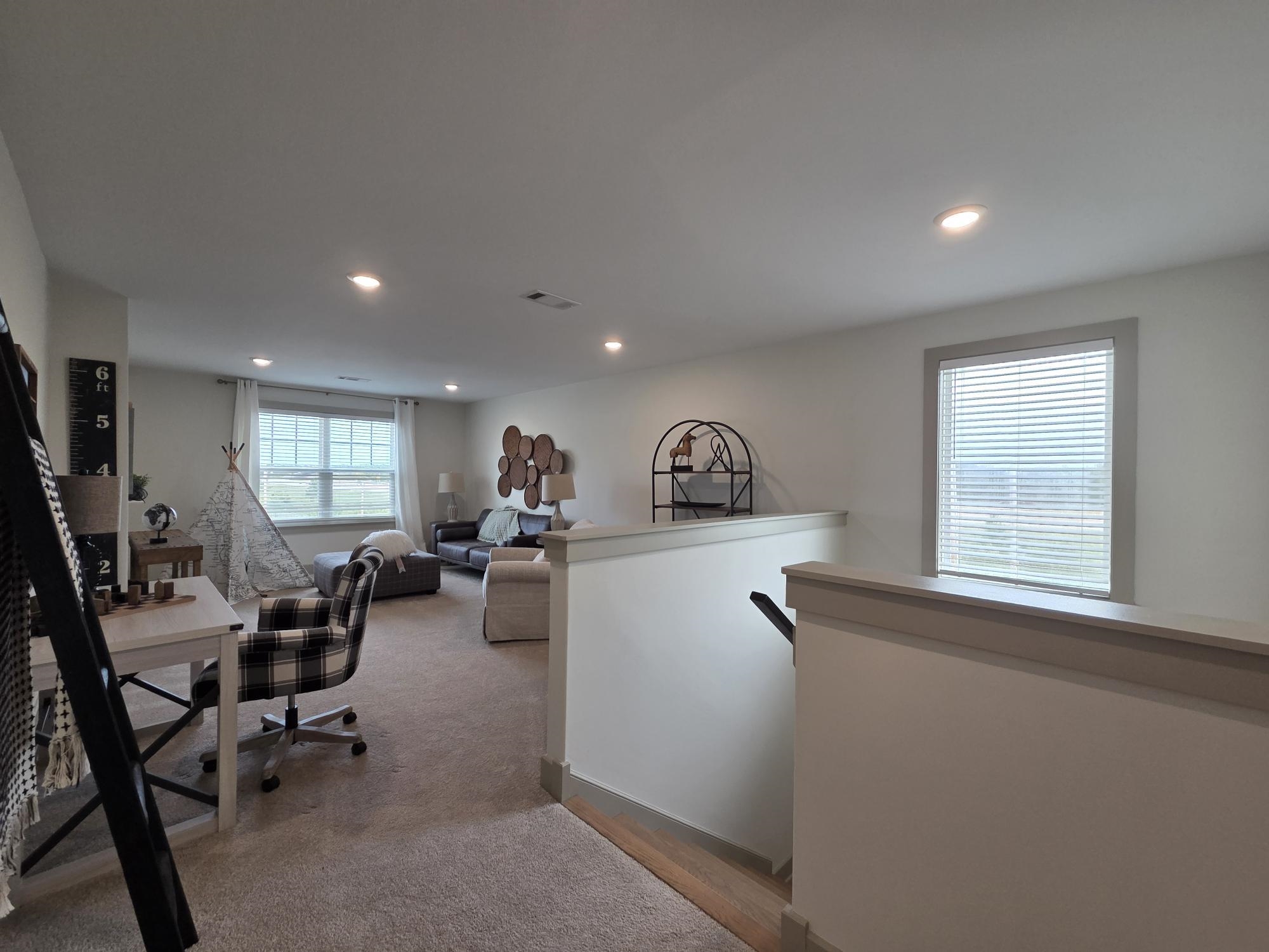 657 Mount Laurel Drive Collierville, TN 38017 - Photo 29 of 40 a view of a livingroom with workspace and a window