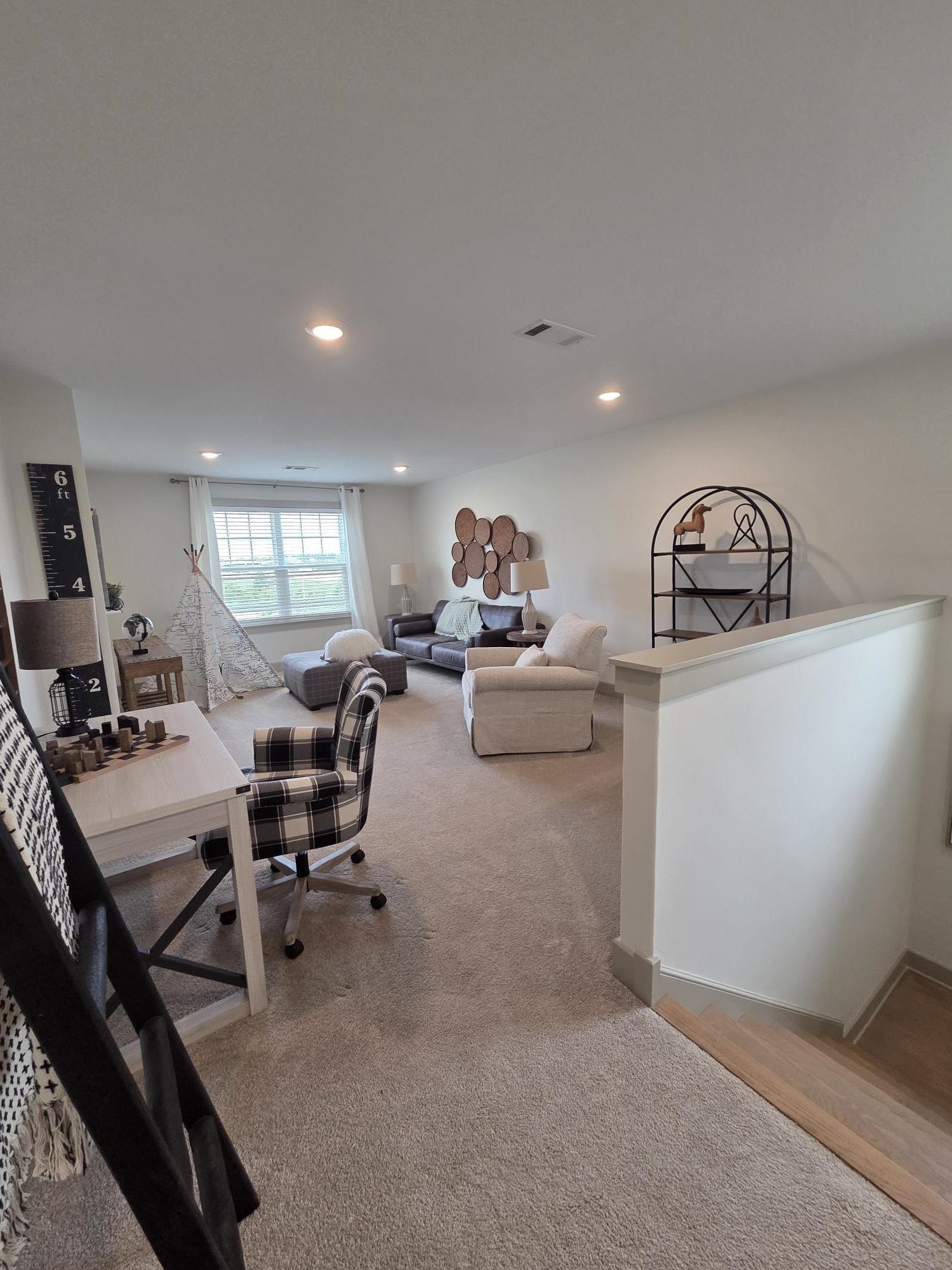 657 Mount Laurel Drive Collierville, TN 38017 - Photo 30 of 40 a view of a livingroom with workspace and a couch