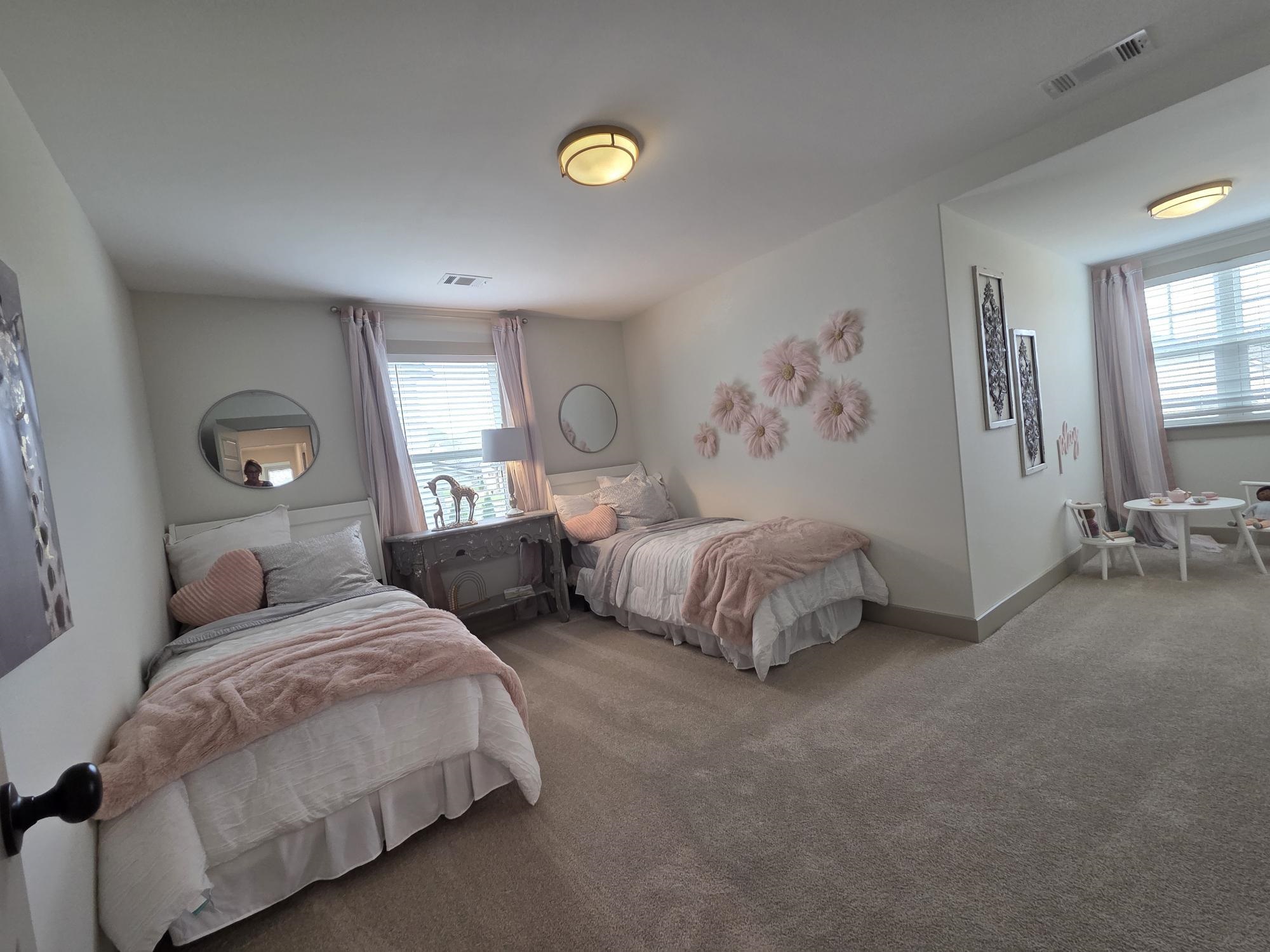 657 Mount Laurel Drive Collierville, TN 38017 - Photo 36 of 40 a bedroom with two beds and painting on the wall