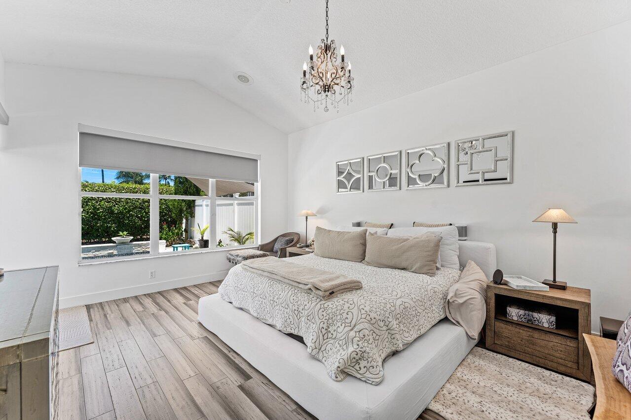3395 Northwest 53rd Circle Boca Raton, FL 33496 - Photo 11 of 64 a living room with a bed furniture and a window