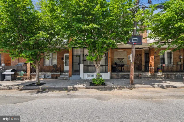 a front view of a house with street view