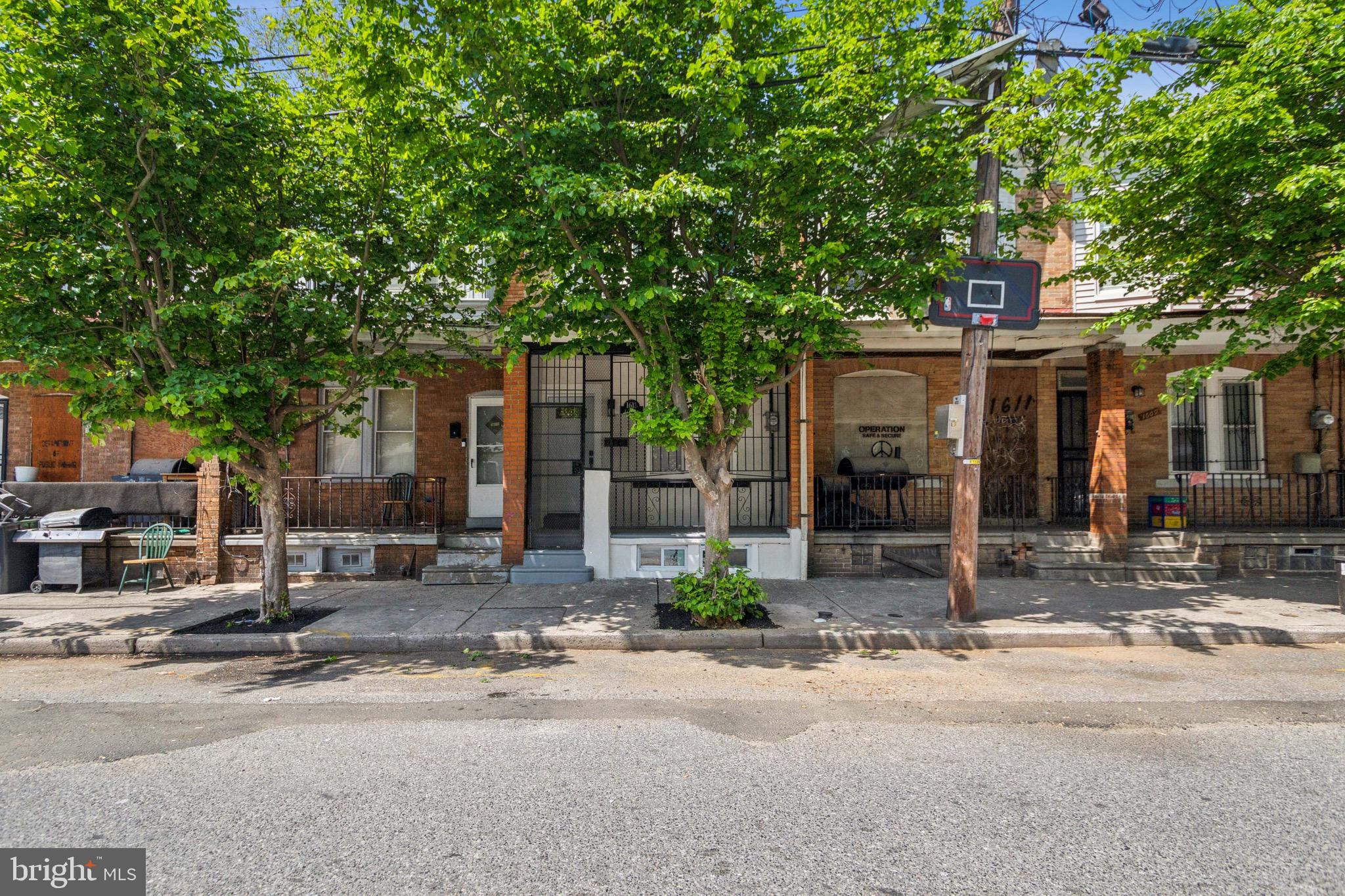 a front view of a house with street view