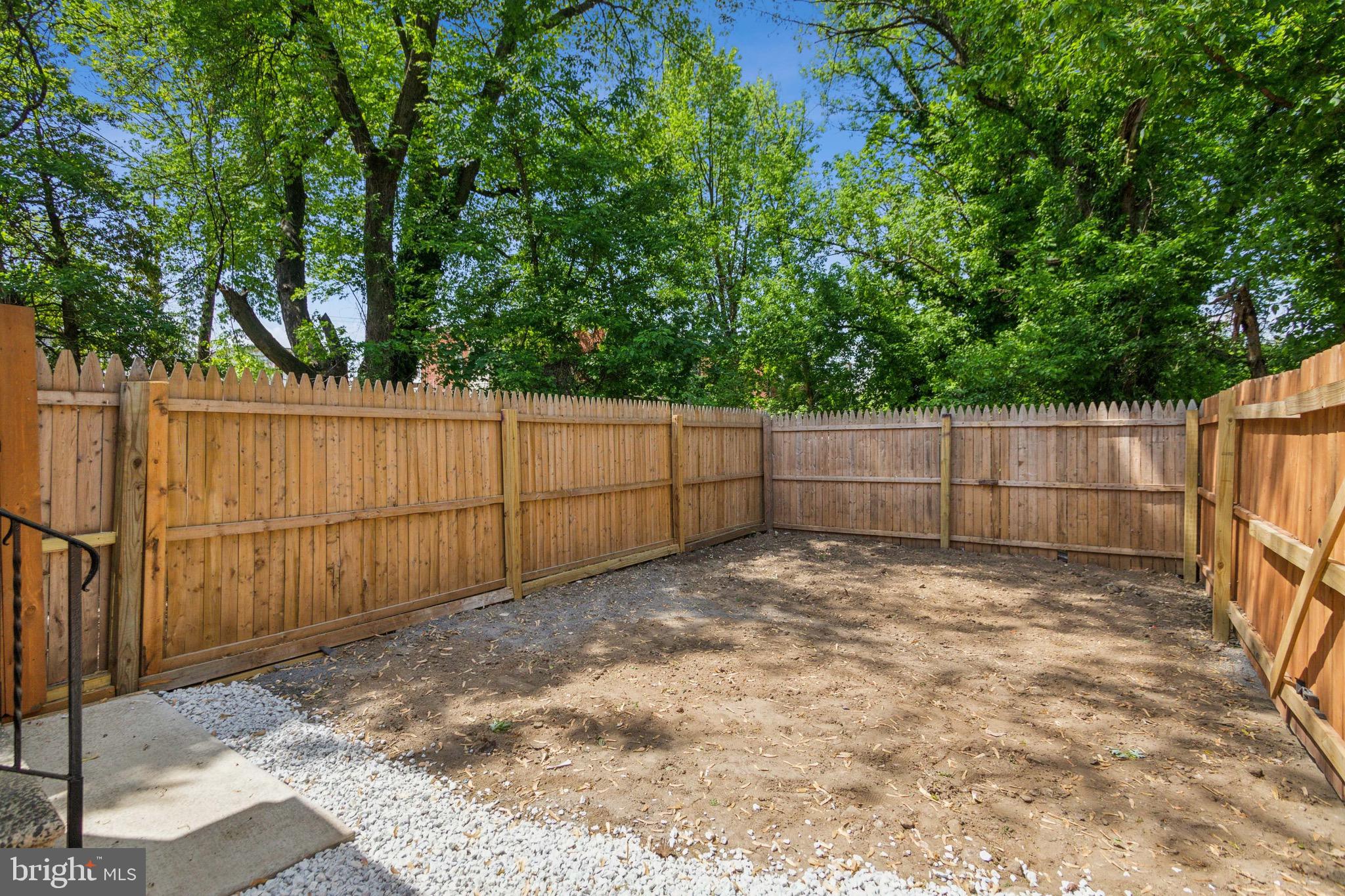 1613 Louis Street Camden, NJ 08104 - Photo 22 of 22 a view of backyard with wooden fence