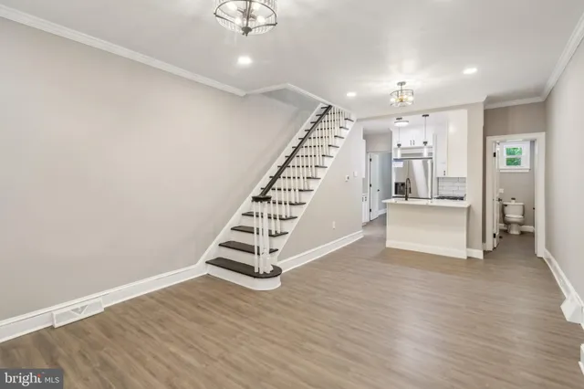 a view of wooden floor and stairs in a room