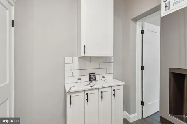 a bathroom with a sink a vanity and a mirror