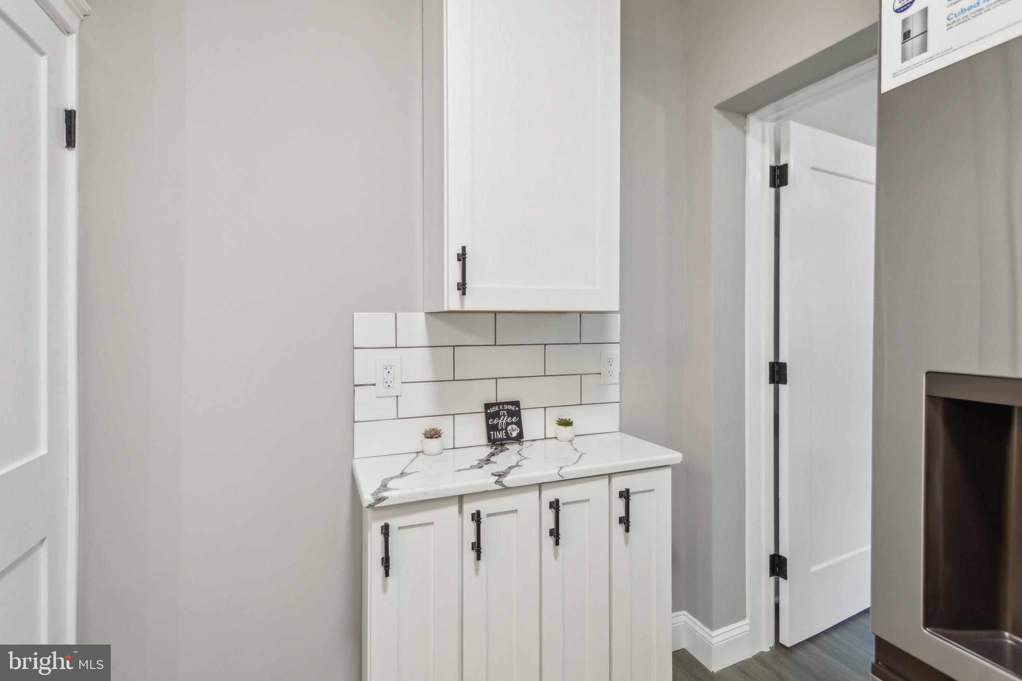 1613 Louis Street Camden, NJ 08104 - Photo 9 of 22 a bathroom with a sink a vanity and a mirror