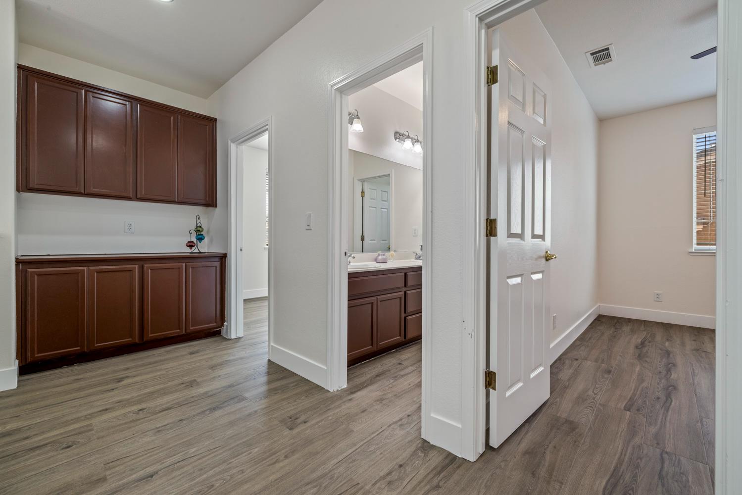 3105 Ripple Court Modesto, CA 95355 - Photo 34 of 46 a view of a kitchen with wooden floor and electronic appliances