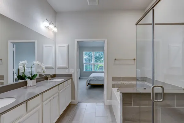 a bedroom with a bed and a desk