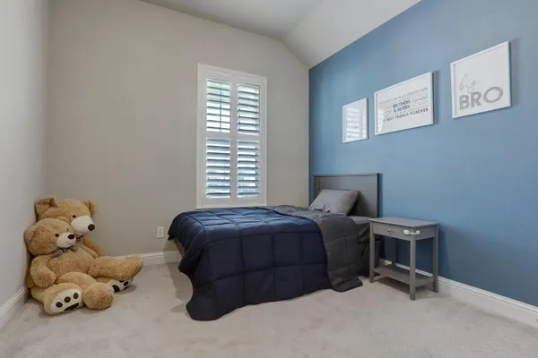 a bathroom with a sink a toilet a mirror a bathtub and shower