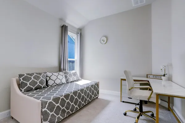 a view of a porch with furniture and a yard