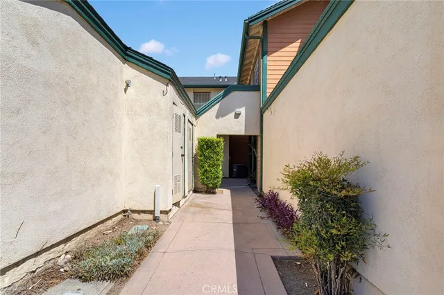 a porch with seating space and a potted plant