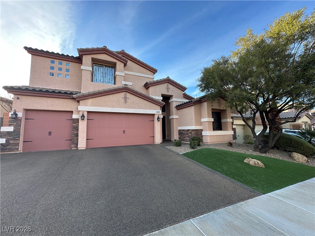 309 Goldstar Street Henderson, NV 89012 - Photo 3 of 46 Pebble driveway.