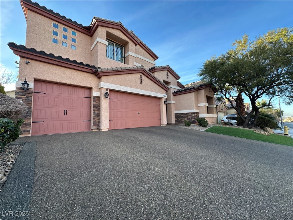 309 Goldstar Street Henderson, NV 89012 - Photo 46 of 46 Pebble driveway.