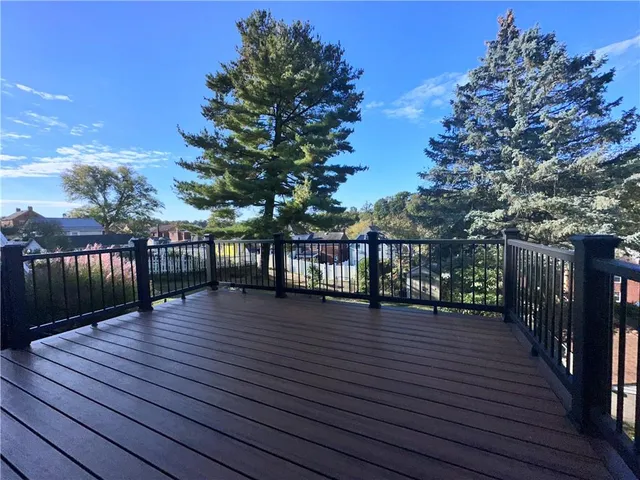 a view of a balcony with wooden floor