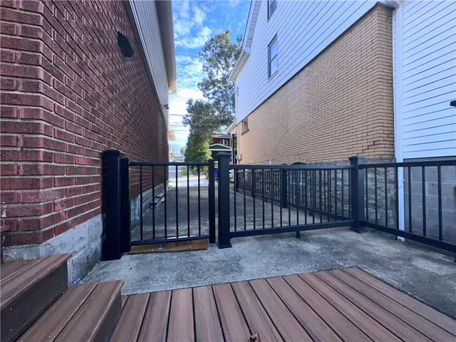 a view of backyard with a deck