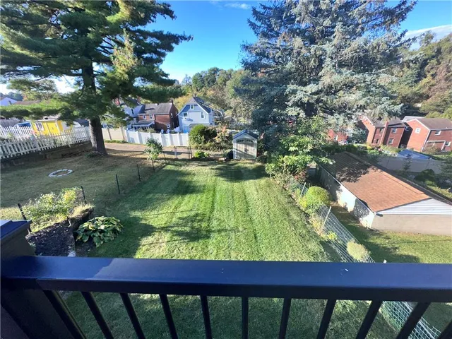 a view of swimming pool with a yard