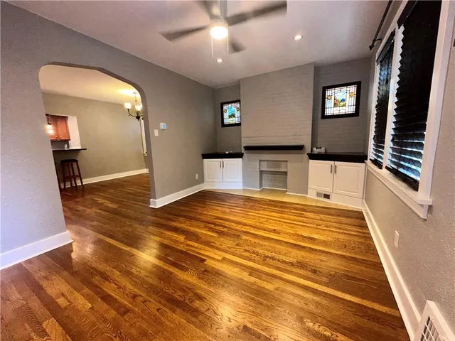 a view of a livingroom with furniture and staircase
