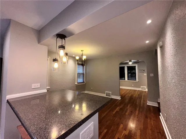 a view of a living room and wooden floor