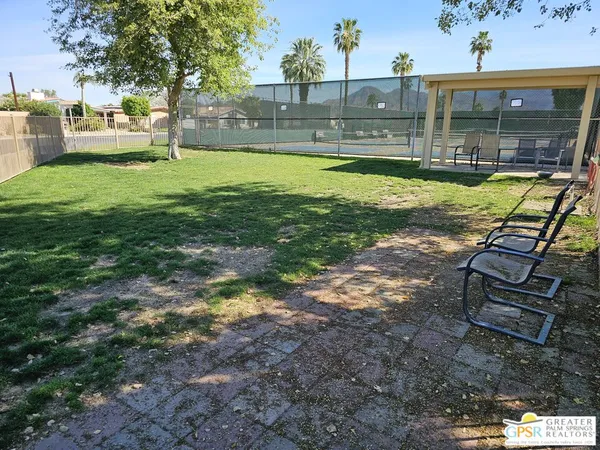 a view of a yard with patio