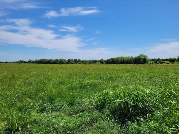 a view of a lake with a big yard