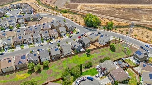 an aerial view of a house with a swimming pool yard and outdoor seating