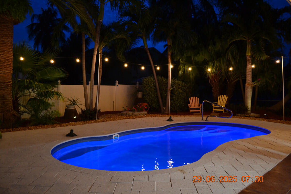 1109 76 Street, Unit OCEAN Marathon, FL 33050 - Photo 22 of 24 a view of swimming pool with outdoor seating and patio