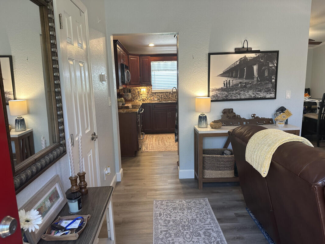 1109 76 Street, Unit OCEAN Marathon, FL 33050 - Photo 5 of 24 a living room with furniture and a flat screen tv