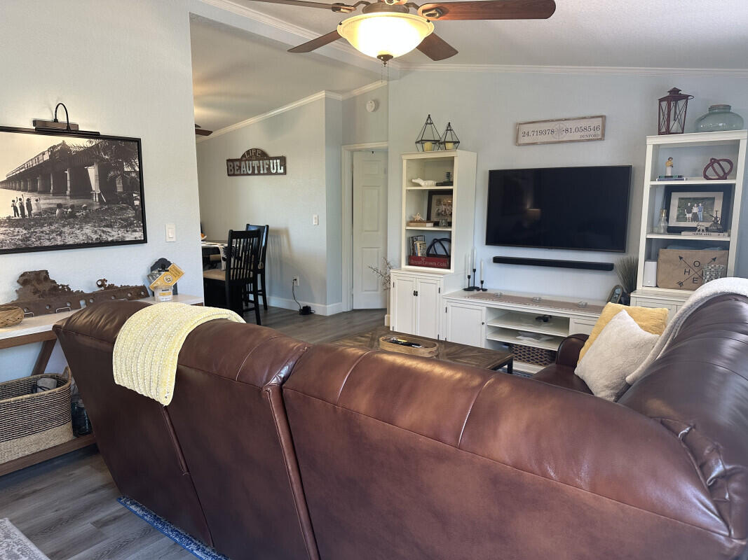 1109 76 Street, Unit OCEAN Marathon, FL 33050 - Photo 6 of 24 a living room with furniture and a flat screen tv