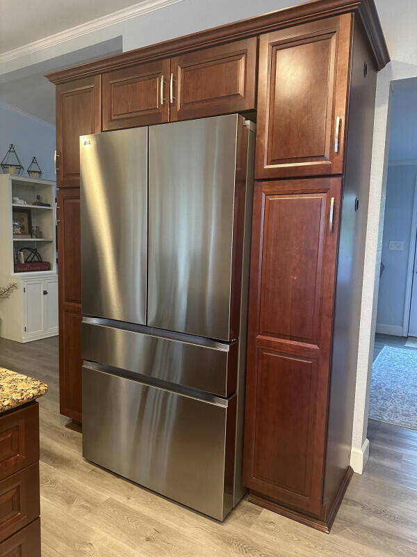 1109 76 Street, Unit OCEAN Marathon, FL 33050 - Photo 9 of 24 a metallic refrigerator freezer sitting in a kitchen