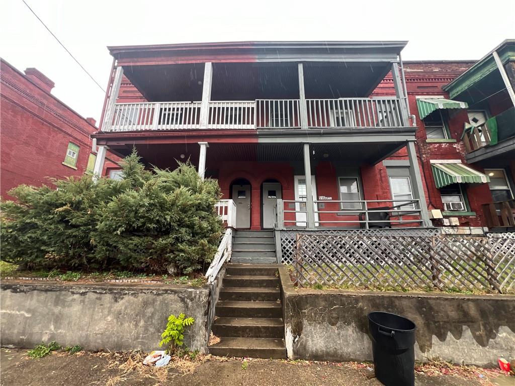 a front view of a house with garage
