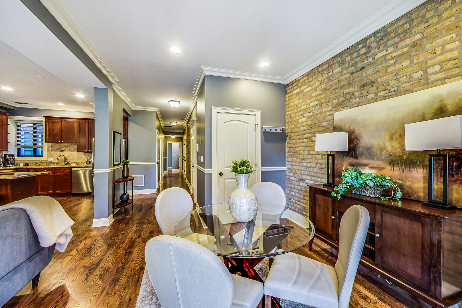 5219 North Winthrop Avenue, Unit 2N Chicago, IL 60640 - Photo 12 of 32 a view of a dining room with furniture and wooden floor