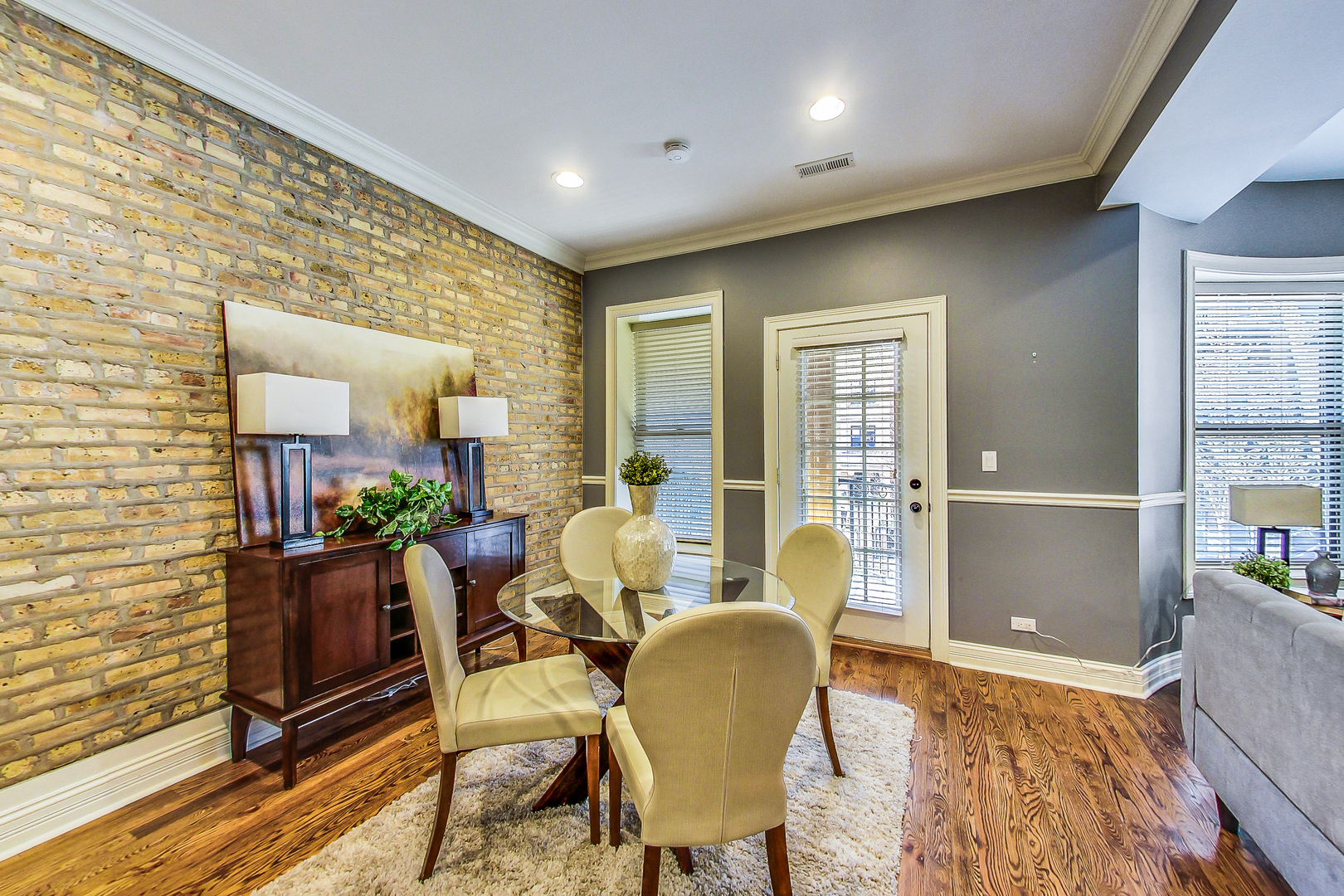 5219 North Winthrop Avenue, Unit 2N Chicago, IL 60640 - Photo 13 of 32 a dining room with furniture and wooden floor