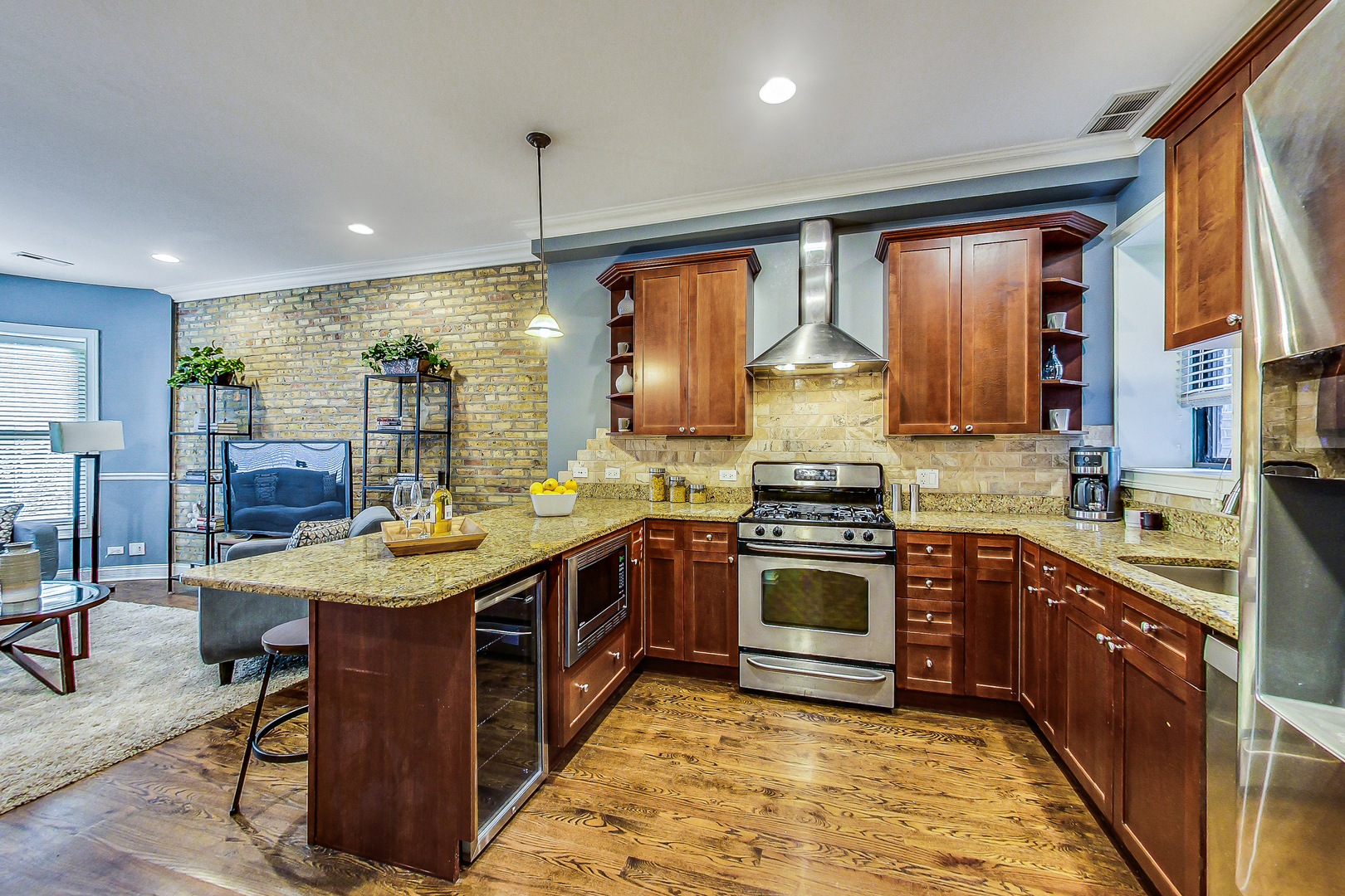 5219 North Winthrop Avenue, Unit 2N Chicago, IL 60640 - Photo 15 of 32 a kitchen with stainless steel appliances granite countertop a stove and a sink